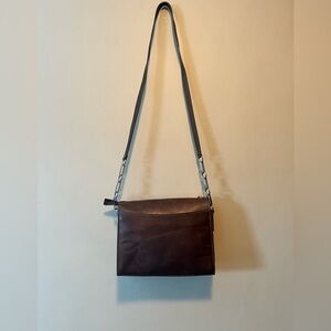 Mark Cross vintage leather cross body bag in chocolate brown. Zip top.